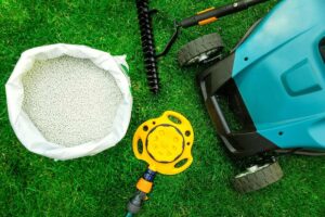 green grass mower fertilizer rake sprinkler